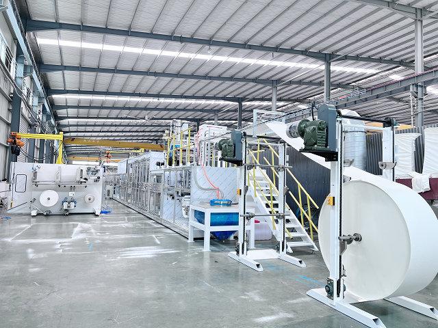 What is the average production cycle time for a sanitary pad machine